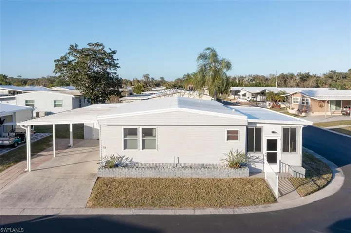 View of front facade featuring a carport