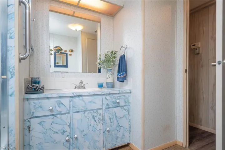 Bathroom featuring vanity and hardwood / wood-style flooring