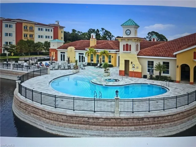 Community pool with a patio
