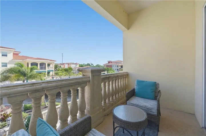 View of balcony off owners suite in primary bedroom.