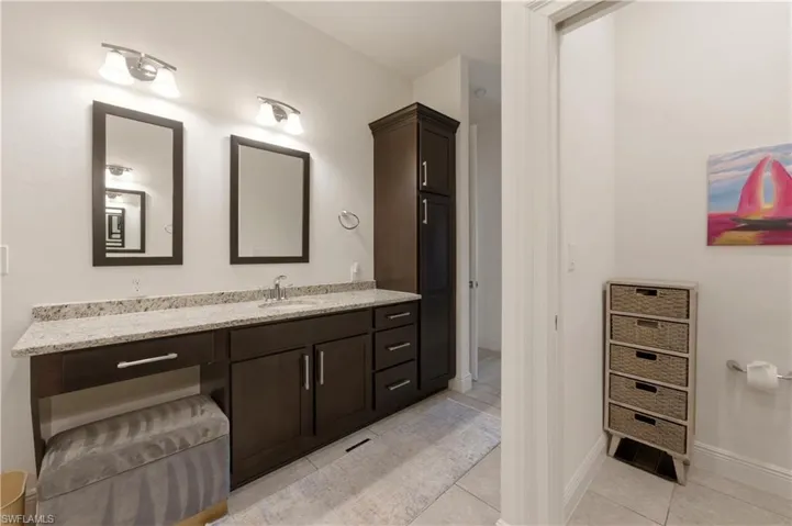 Bathroom featuring vanity and light tile patterned floors