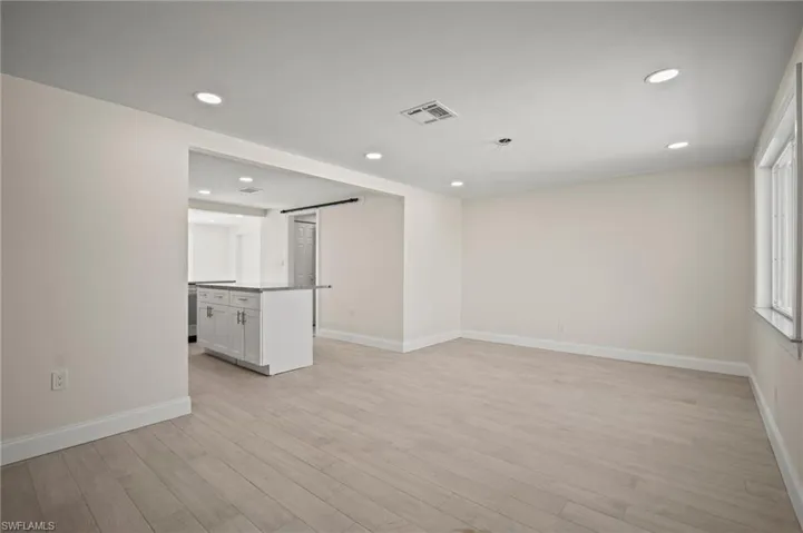 Spare room featuring light wood-style floors and recessed lighting