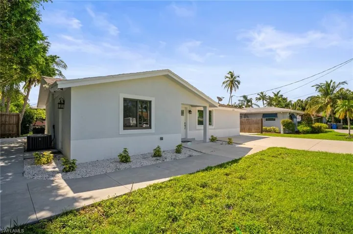Ranch-style house featuring stucco siding