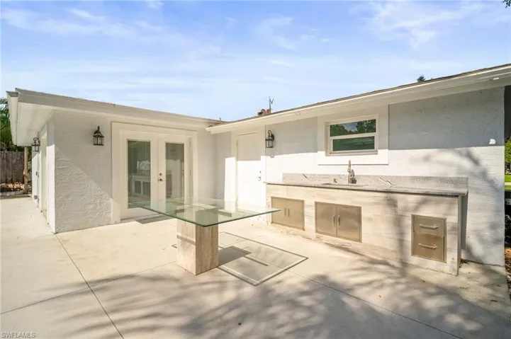 View of patio / terrace featuring french doors and exterior kitchen