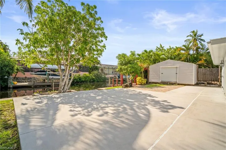 View of patio / terrace featuring a shed