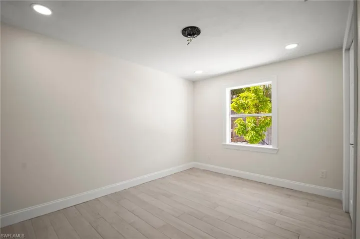 Spare room featuring light wood-style floors and recessed lighting