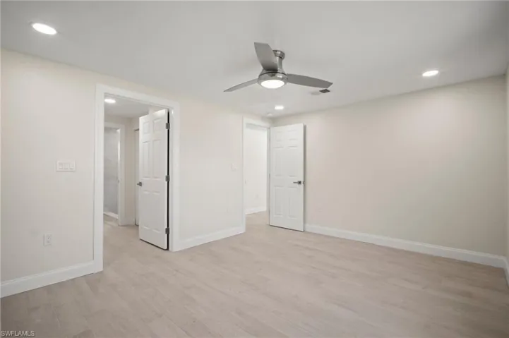 Unfurnished bedroom with light wood-style floors, recessed lighting, and ceiling fan
