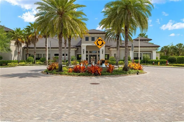 View of property featuring curved driveway