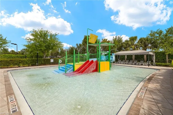 View of playground featuring a patio area