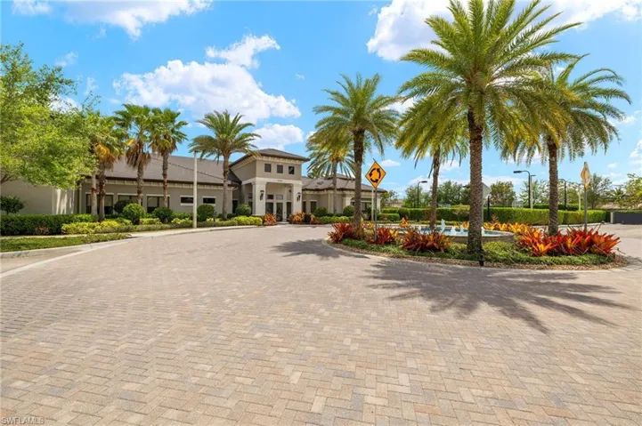 View of property featuring curved driveway