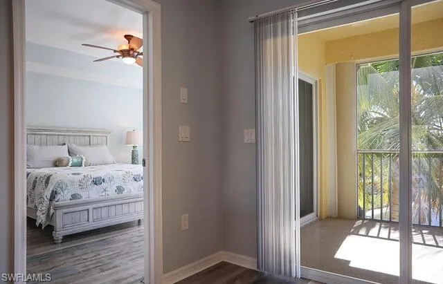 Living area with baseboards and tile patterned flooring