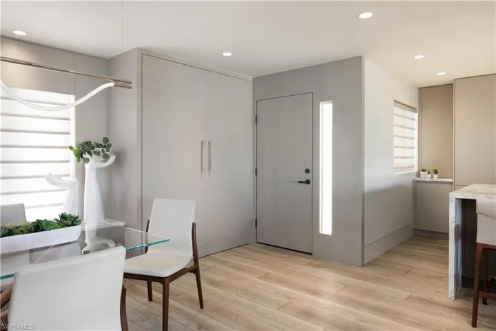 Wine bar and fridge, paneled doorways, and more storage