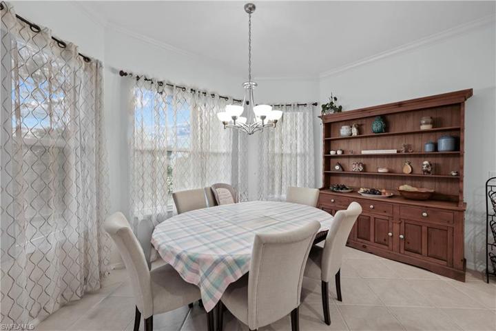 Large morning room off of kitchen with view to the private back yard.