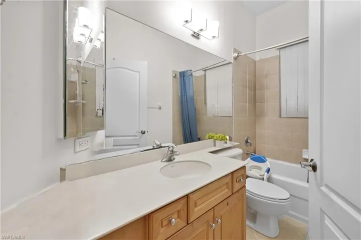 Guest bath with tub/shower combination.