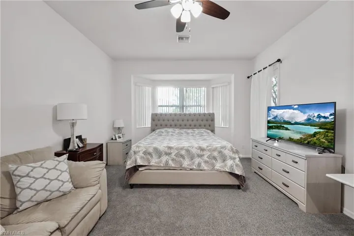 Large owners suite provides room for additional seating and desk, door to lanai.