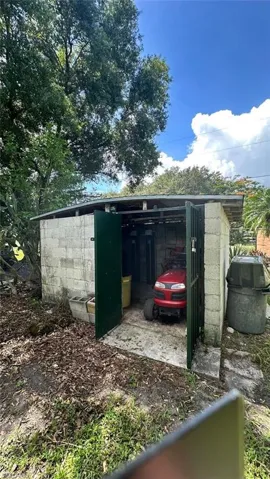 View of outbuilding with a carport