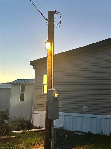 View of property exterior at dusk