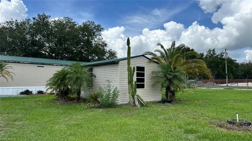 View of side of property with a metal roof
