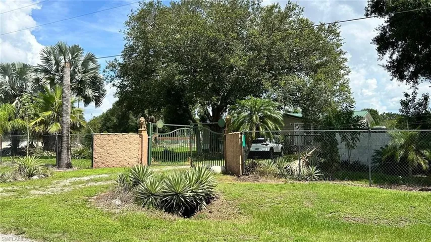 View of yard featuring a gate