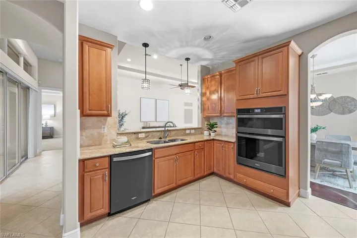 kitchen with access to lanai and pass through to breakfast bar