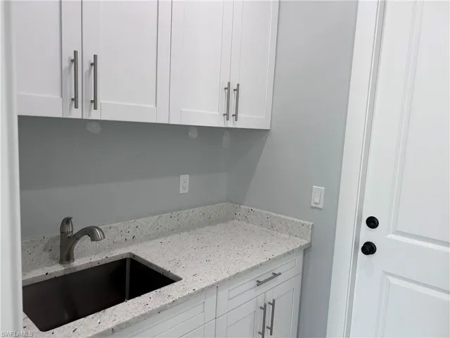 Laundry room featuring sink