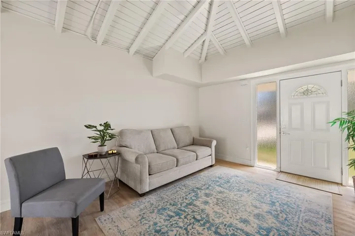 Vaulted ceilings, lots of natural light, wood like laminate flooring