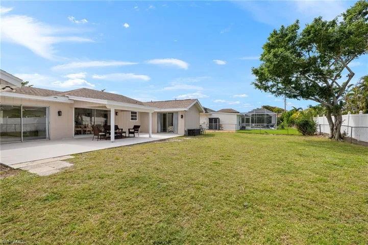 View of yard with a patio area and a fenced backyard