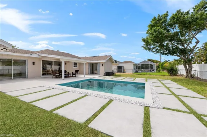 Virtual Rendering: View of swimming pool featuring a fenced in pool, a patio area, a lawn, and fence