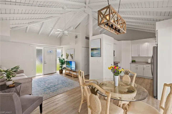 Dining area featuring  beamed ceiling, and light wood-style flooring