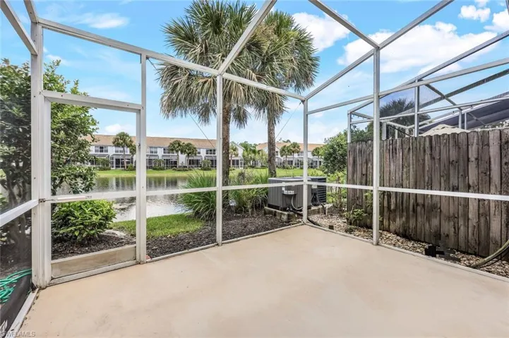 Unfurnished sunroom with a water view