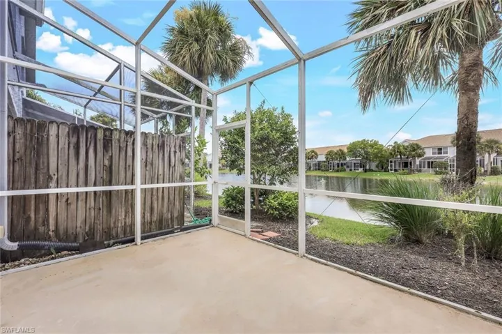 Unfurnished sunroom featuring a water view