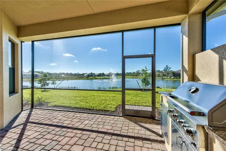 Screen-enclosed lanai with a water view