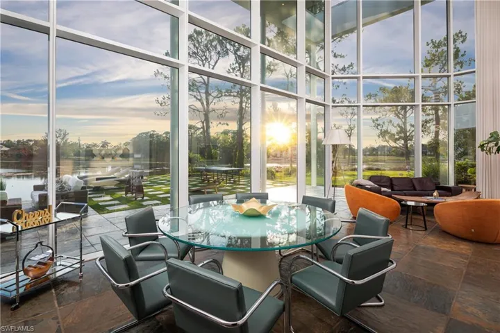 Sunroom / solarium with a water view