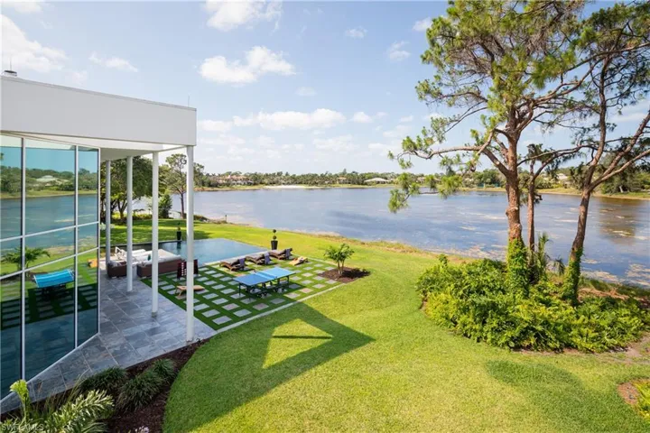 View of yard featuring a water view and a patio area