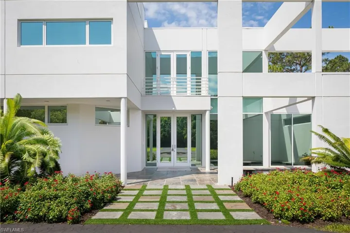 Back of property featuring french doors