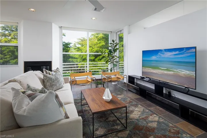 Living room featuring plenty of natural light and expansive windows