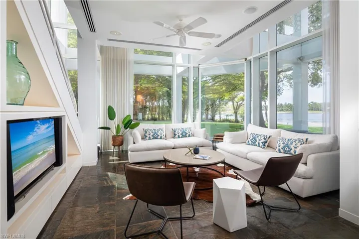 Sunroom / solarium featuring ceiling fan and a wealth of natural light