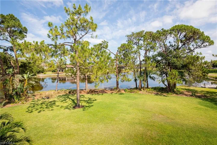View of yard with a water view