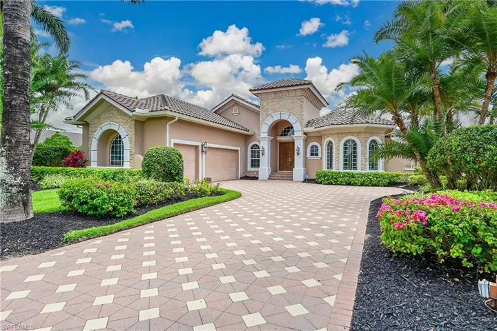 3 Car Garage and designer paver driveway