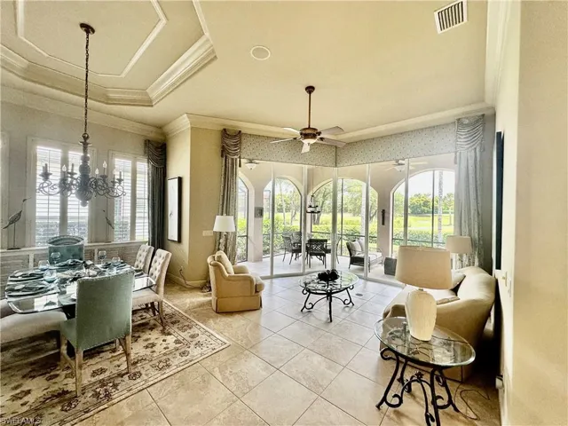 Living room with golf course and lake view