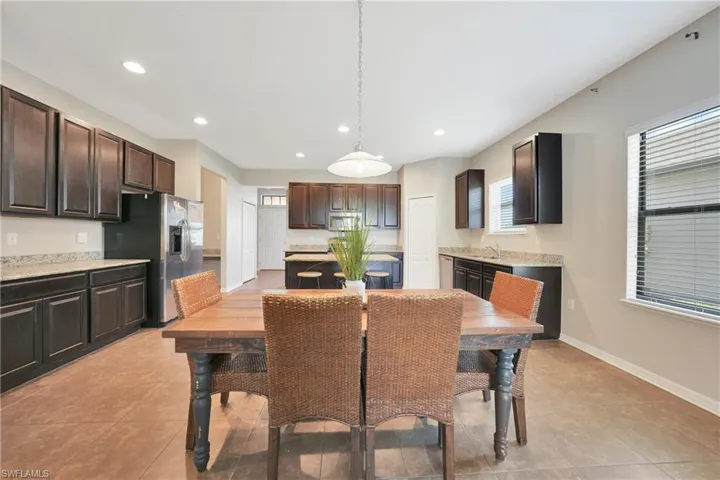 Dining space featuring baseboards, recessed lighting, and light tile patterned floors
