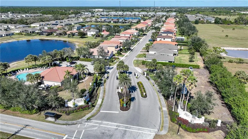 Birds eye view of property featuring a residential view and a water view