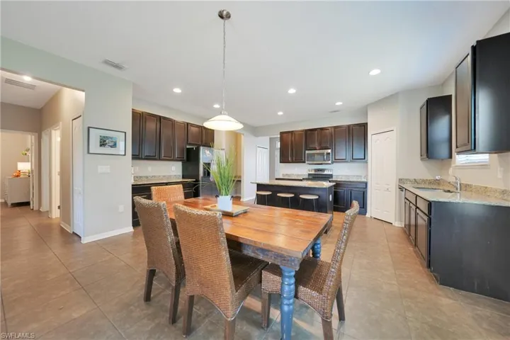 Dining room featuring baseboards, visible vents, recessed lighting, and light tile patterned floors
