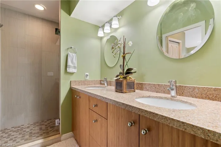 Bathroom with vanity and walk in shower