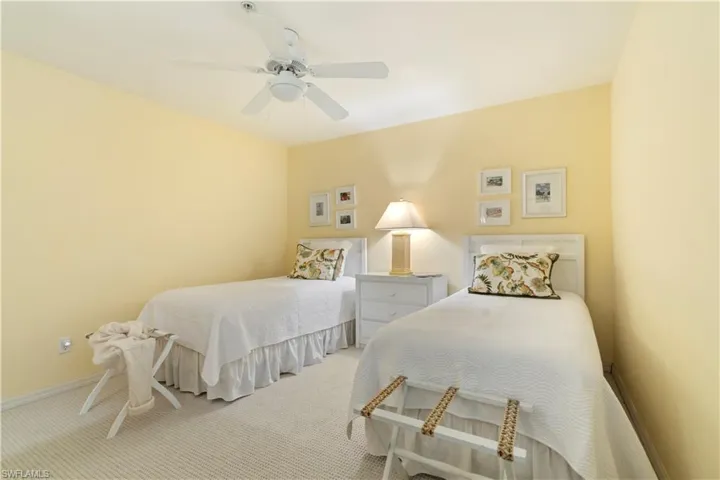 Carpeted bedroom with ceiling fan