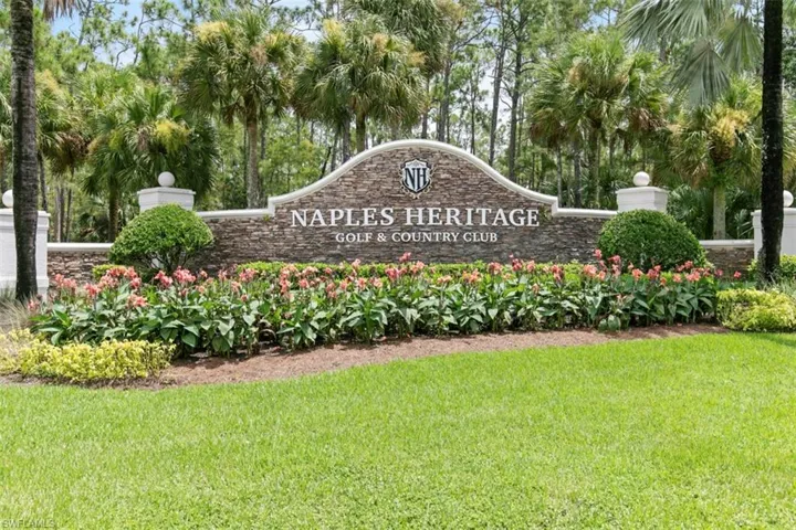 Community / neighborhood sign with a yard