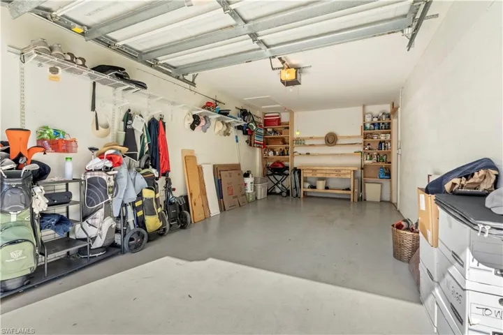 Garage featuring a garage door opener