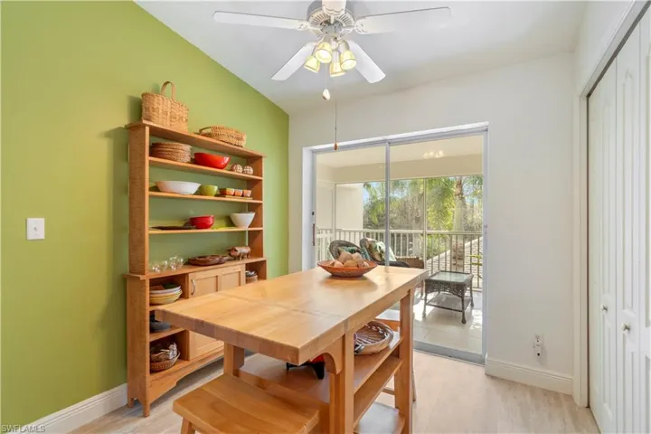 Dining room with ceiling fan and light hardwood / wood-style flooring