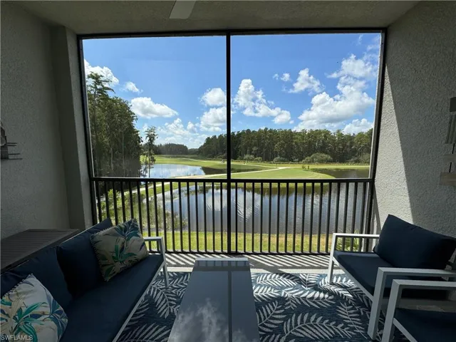 Sunroom with a water view and plenty of natural light