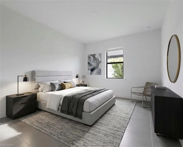 *Virtually Staged*Spacious room featuring light gray tile flooring, a large window with blinds, and white walls